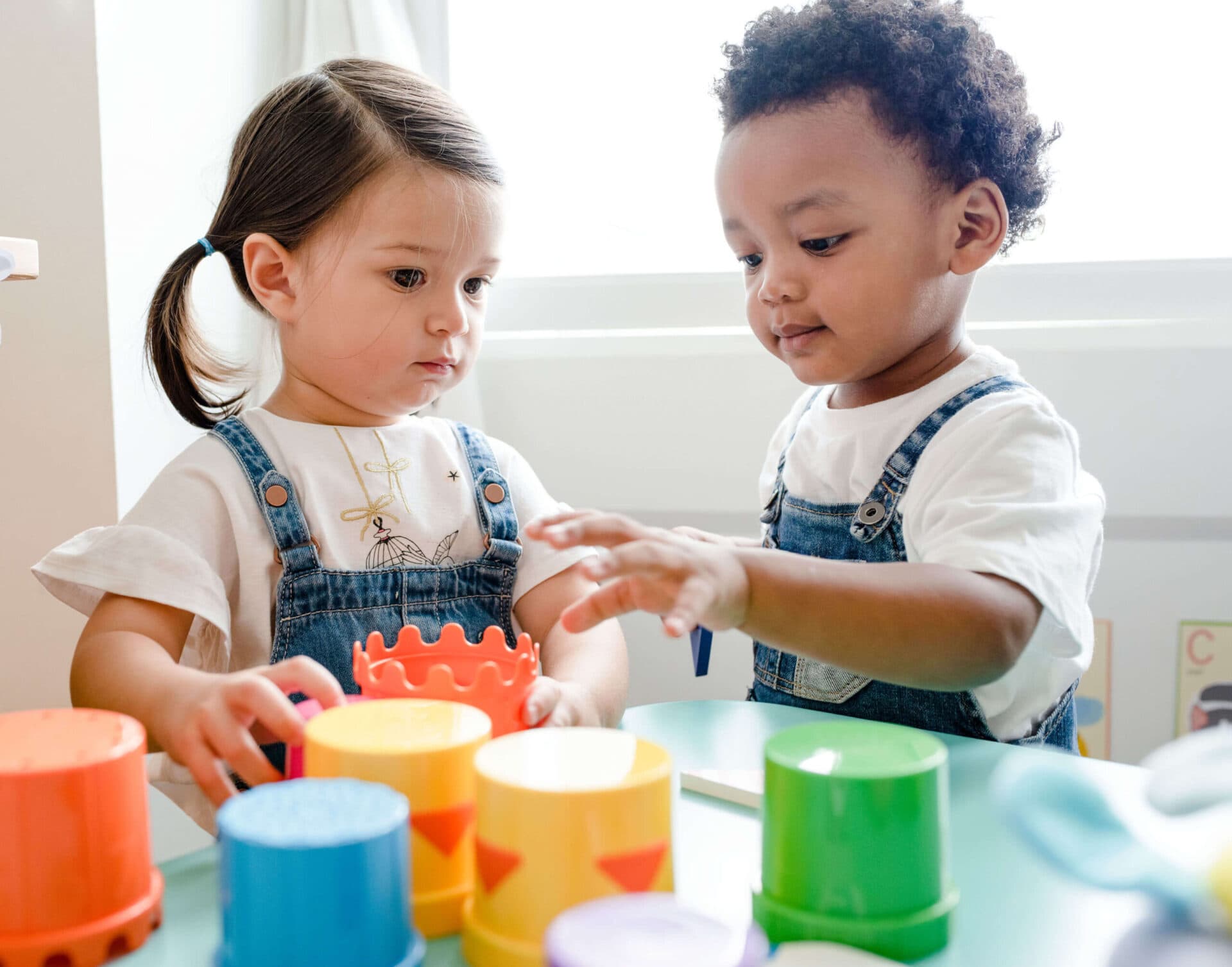 A teacher reading with children at Virginia Early Learning Academies